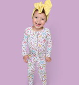 BOW GARDEN DREAM RUFFLE ROMPER from DREAM BIG LITTLE CO