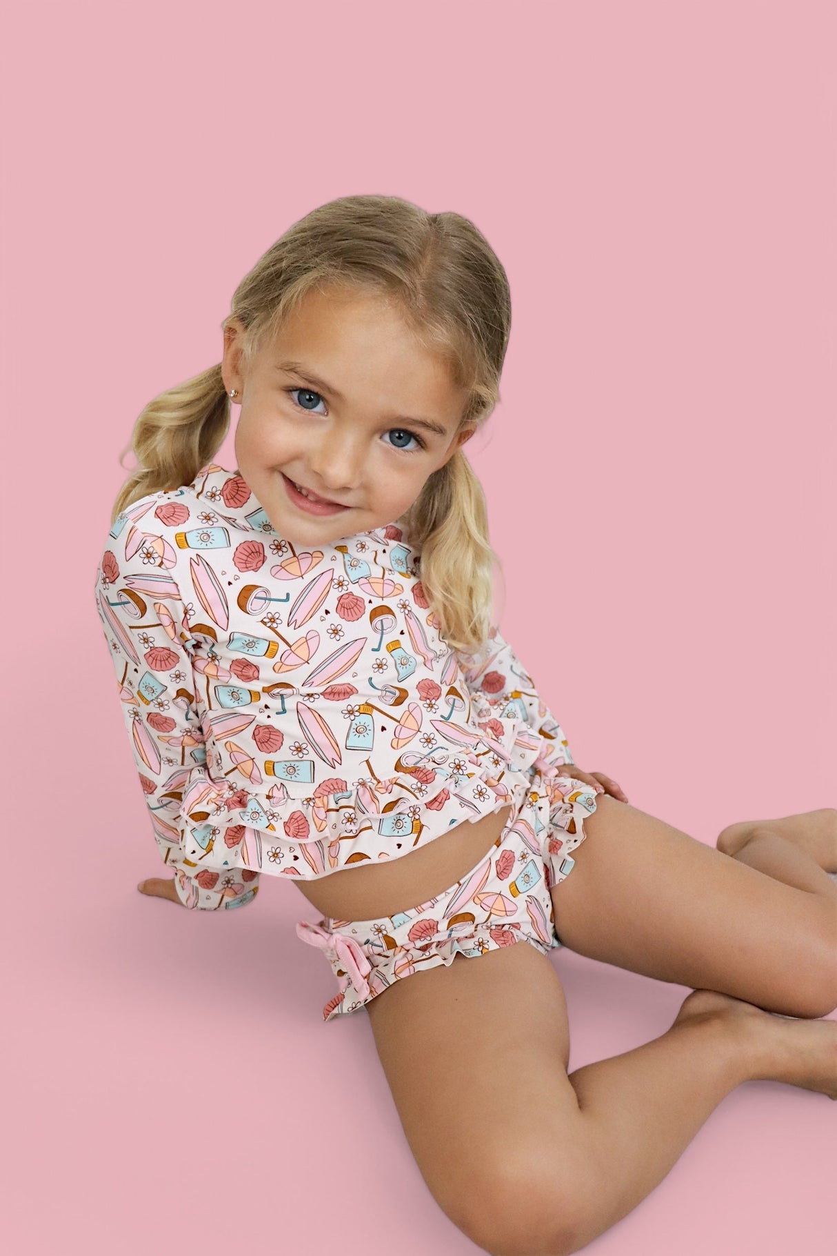 FUN IN THE SUN DREAM TWO-PIECE RASH GUARD RUFFLE SWIM SUIT from DREAM BIG LITTLE CO