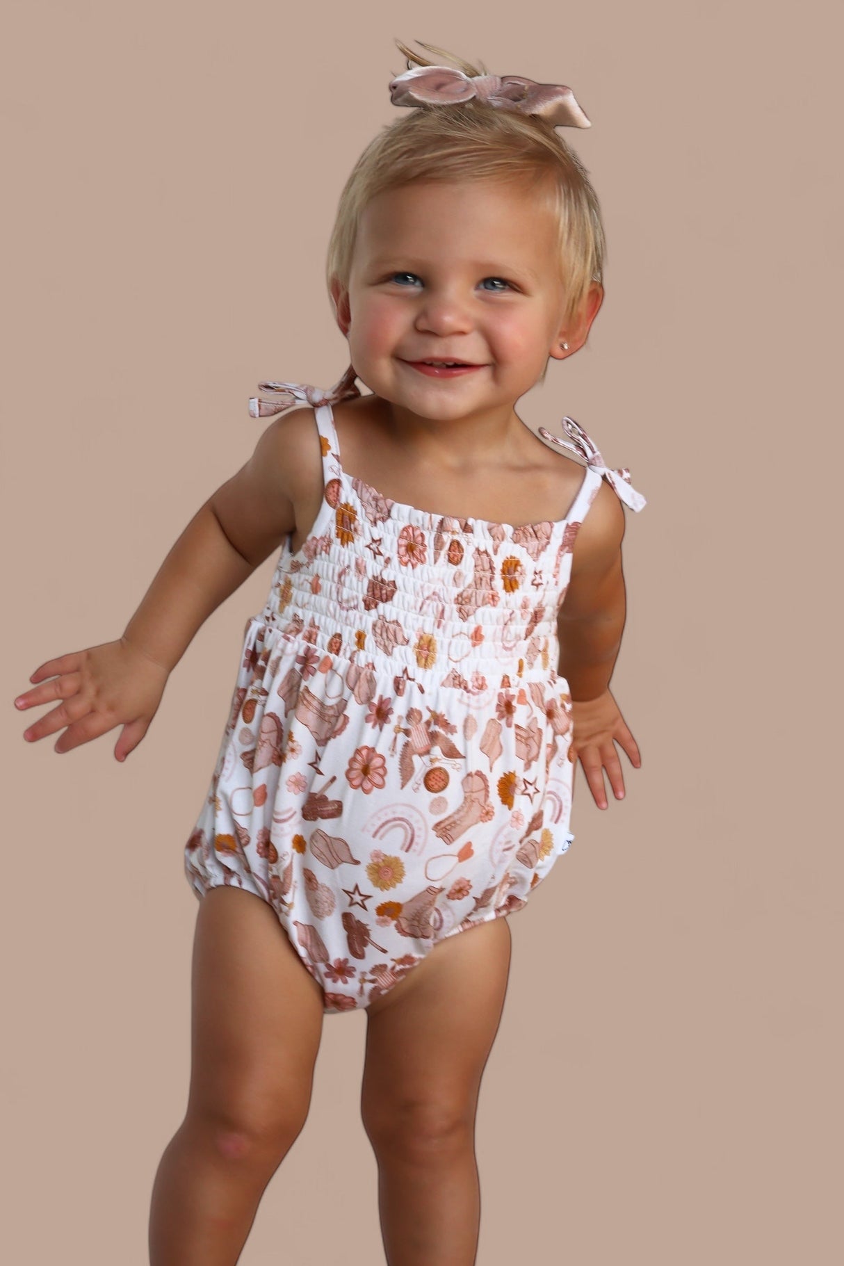 FLOWERS AND BOOTS DREAM BUBBLE ROMPER from DREAM BIG LITTLE CO