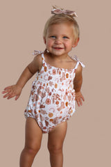 FLOWERS AND BOOTS DREAM BUBBLE ROMPER from DREAM BIG LITTLE CO