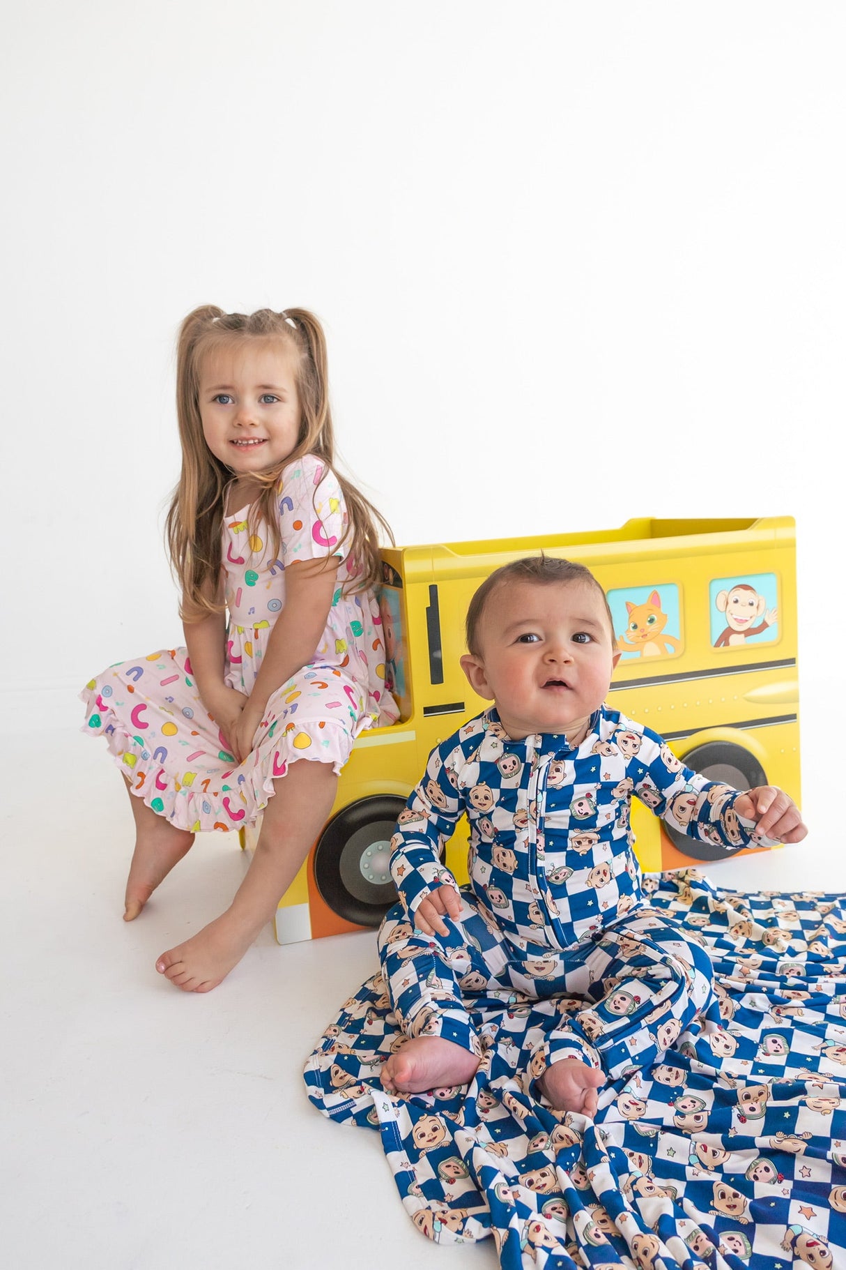 Dream Big Little Co x CoComelon ALPHABET SHORT SLEEVE DREAM RUFFLE DRESS from DREAM BIG LITTLE CO