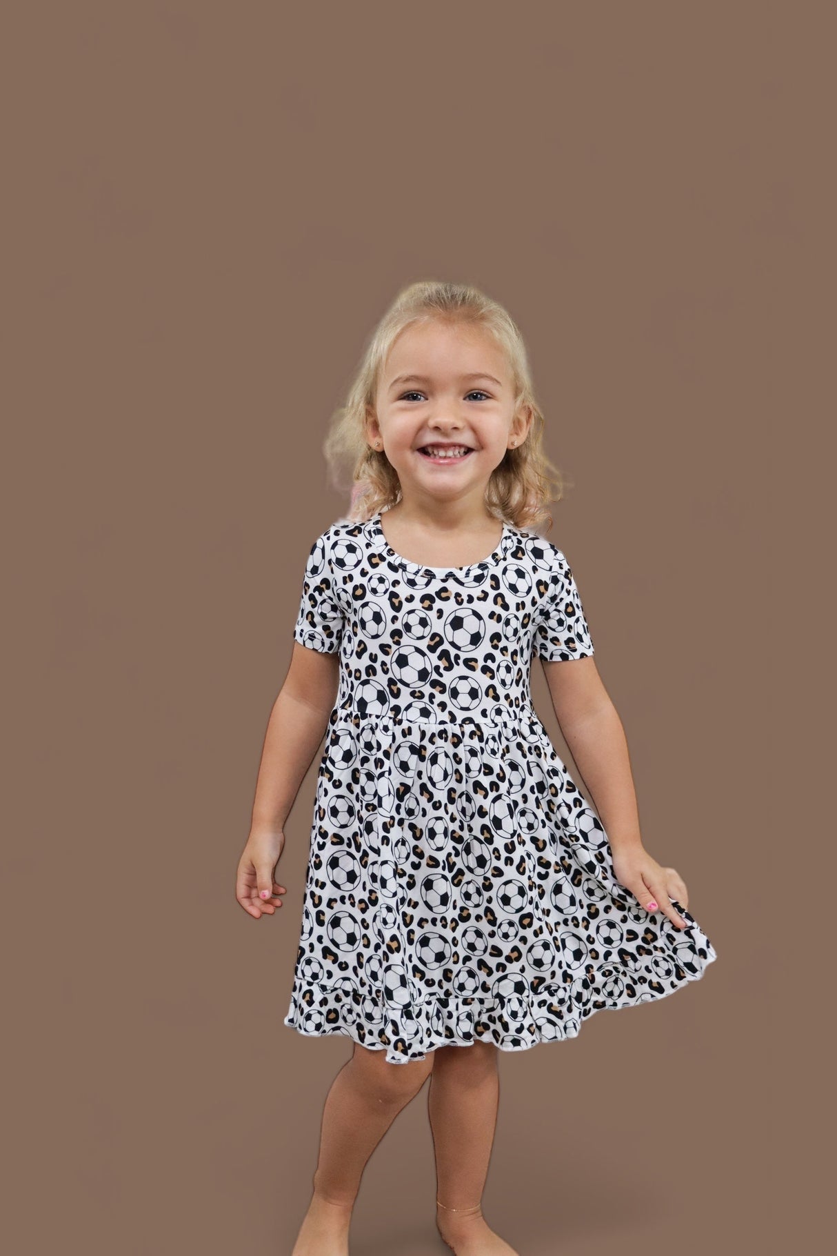 WILD GOALS DREAM RUFFLE DRESS from DREAM BIG LITTLE CO