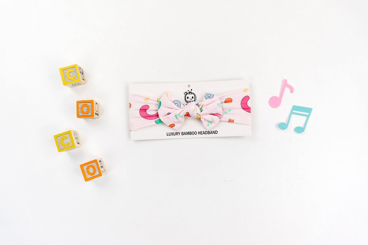 Dream Big Little Co x CoComelon ALPHABET DREAM BOW from DREAM BIG LITTLE CO