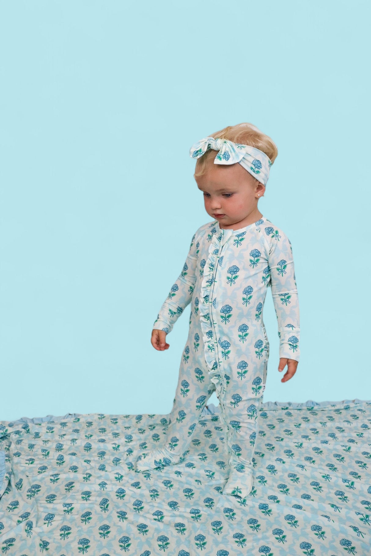 BLUE RIBBON BLOOMS DREAM RUFFLE ROMPER from DREAM BIG LITTLE CO