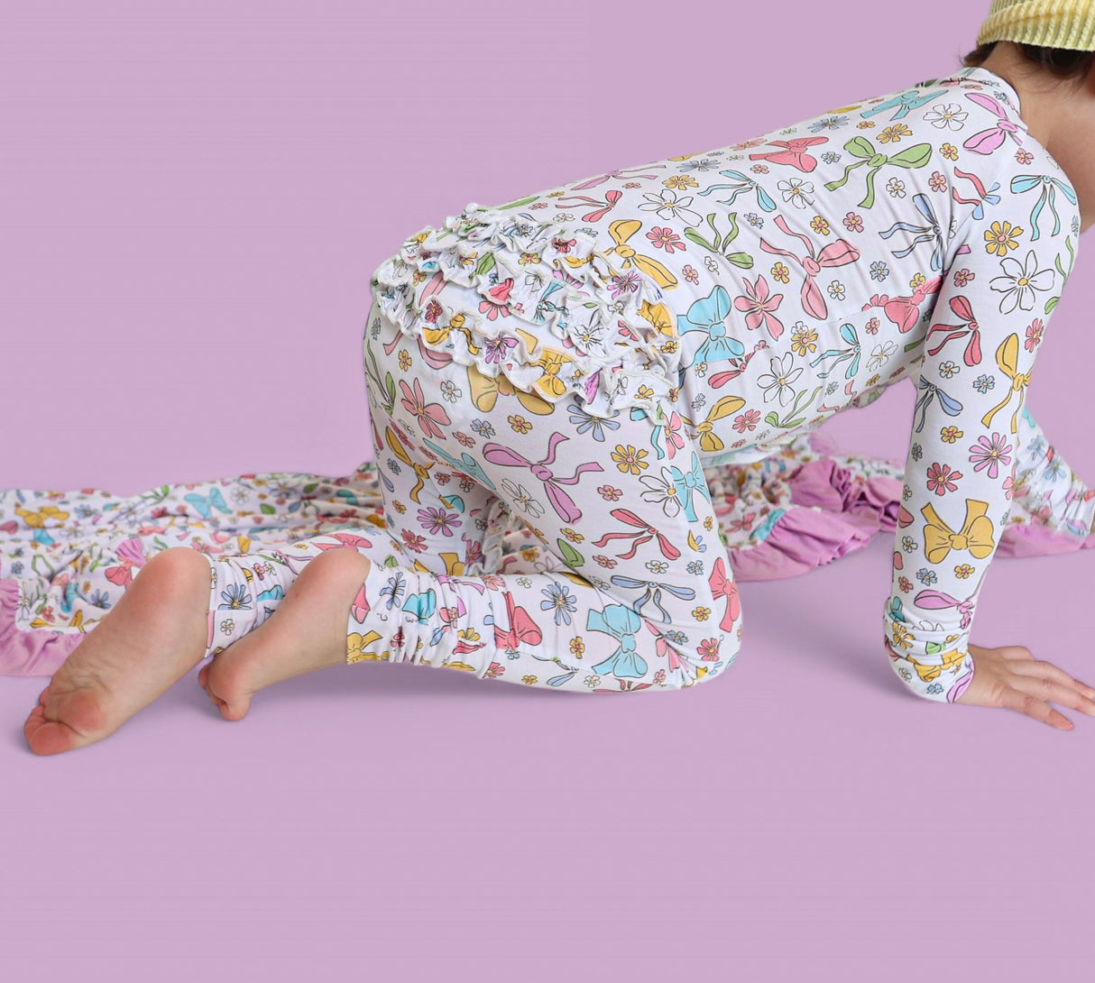 BOW GARDEN DREAM RUFFLE ROMPER from DREAM BIG LITTLE CO