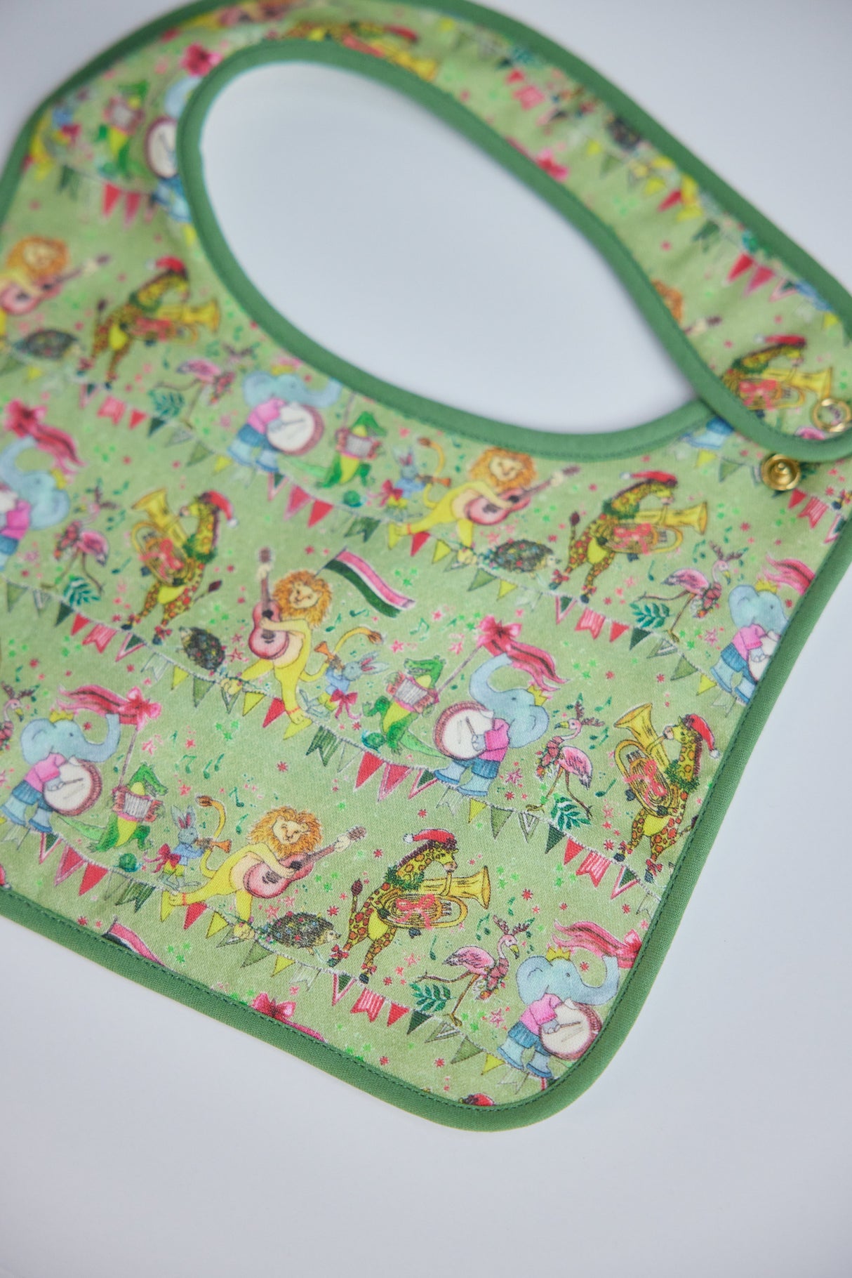 Jubilee Bib in Green from Timo & Violet