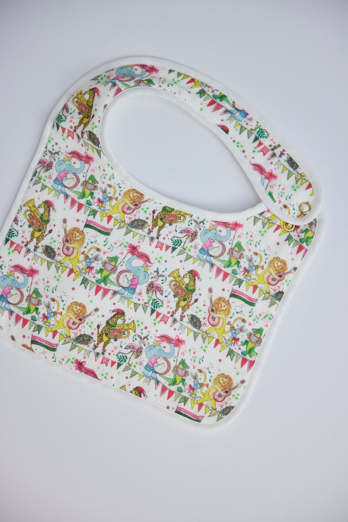 Musical Jubilee Bib in White from Timo & Violet