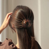 BIRD NEST PONYTAIL HAIR CLAW from Ashlen