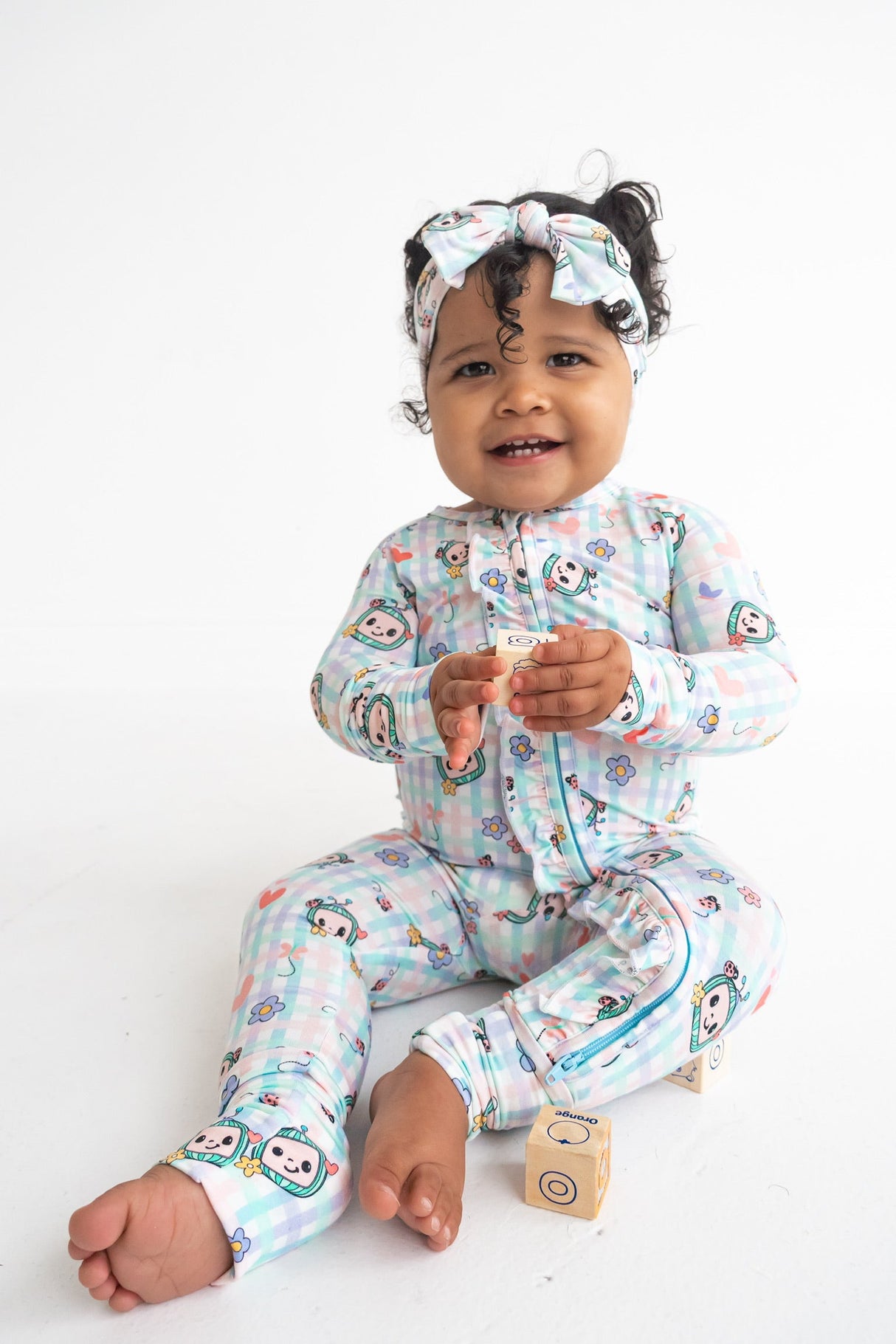 Dream Big Little Co x CoComelon SPRINGTIME MELON DREAM RUFFLE ROMPER from DREAM BIG LITTLE CO