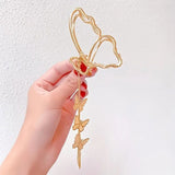 BUTTERFLY TASSEL HAIR CLIP from Ashlen