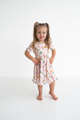 Dream Big Little Co x CoComelon JJ RAINBOW CHECKERS SHORT SLEEVE DREAM RUFFLE DRESS from DREAM BIG LITTLE CO
