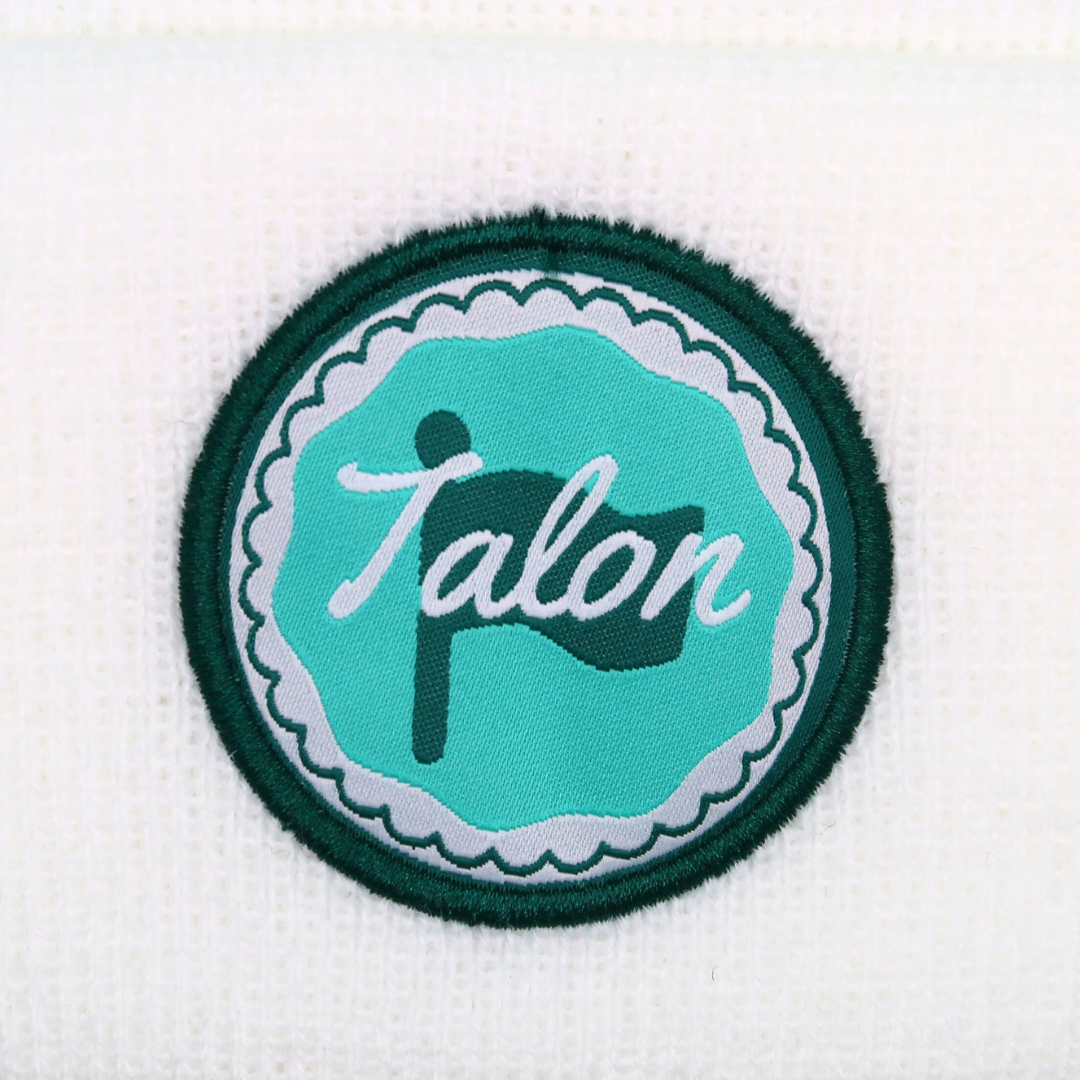 White Knit Beanie w/ Green & Teal Circle Logo from Talon Golf LLC