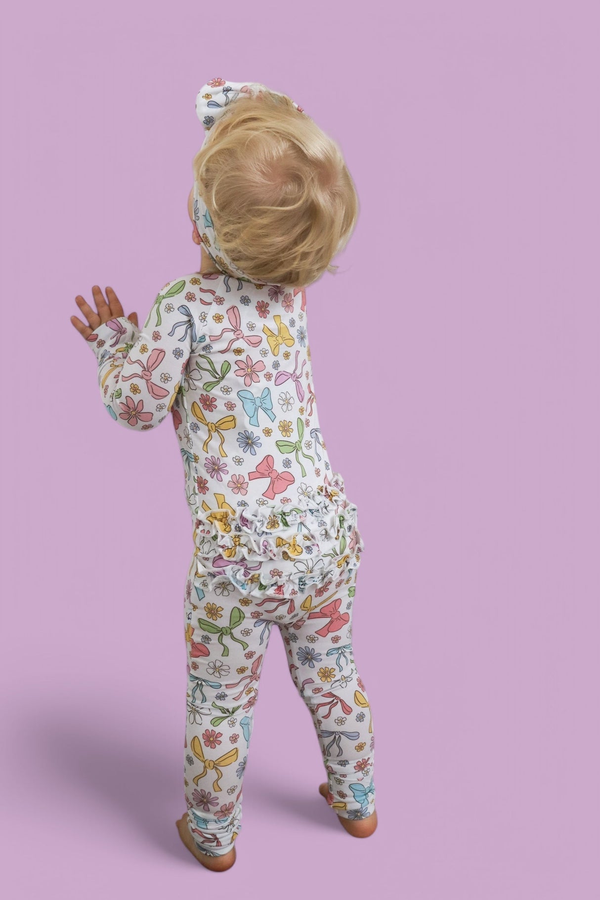 BOW GARDEN DREAM RUFFLE ROMPER from DREAM BIG LITTLE CO