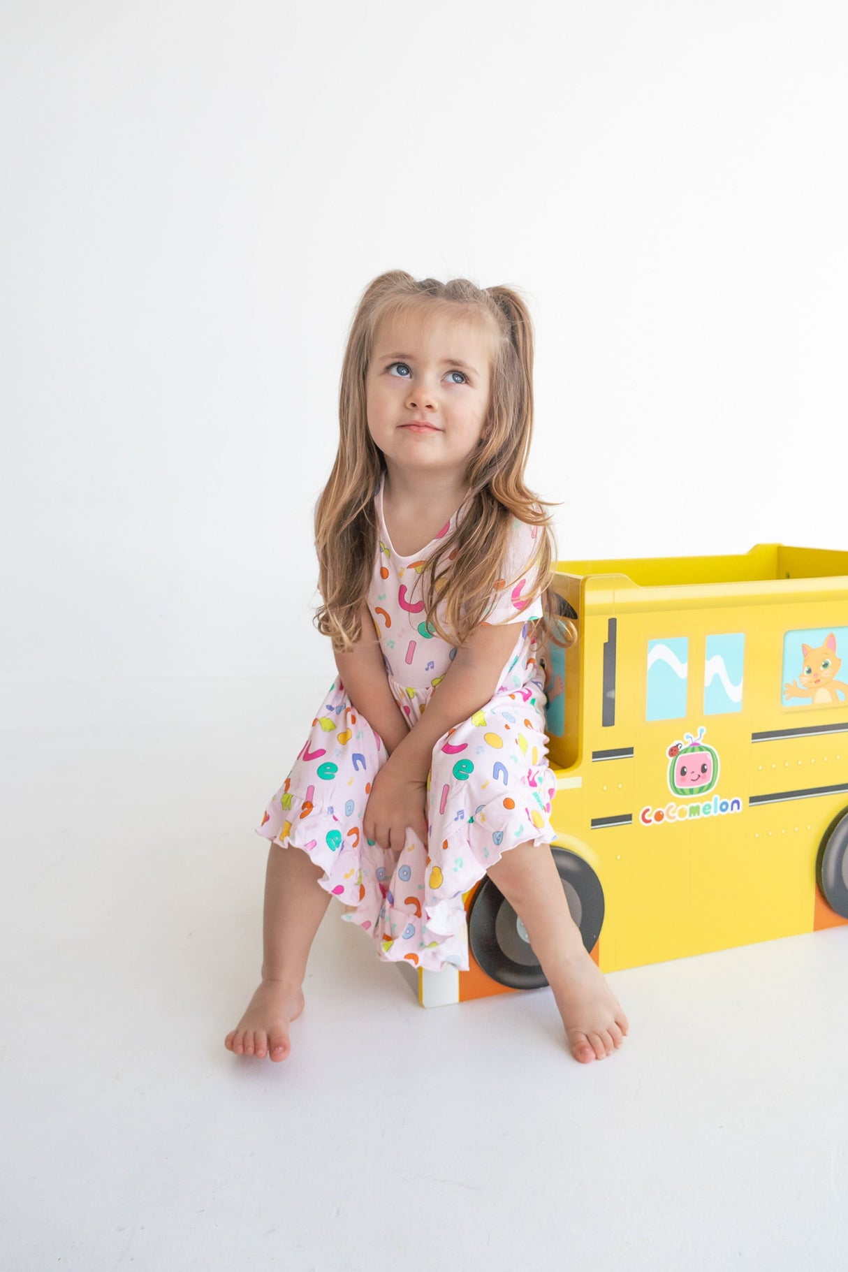 Dream Big Little Co x CoComelon ALPHABET SHORT SLEEVE DREAM RUFFLE DRESS from DREAM BIG LITTLE CO