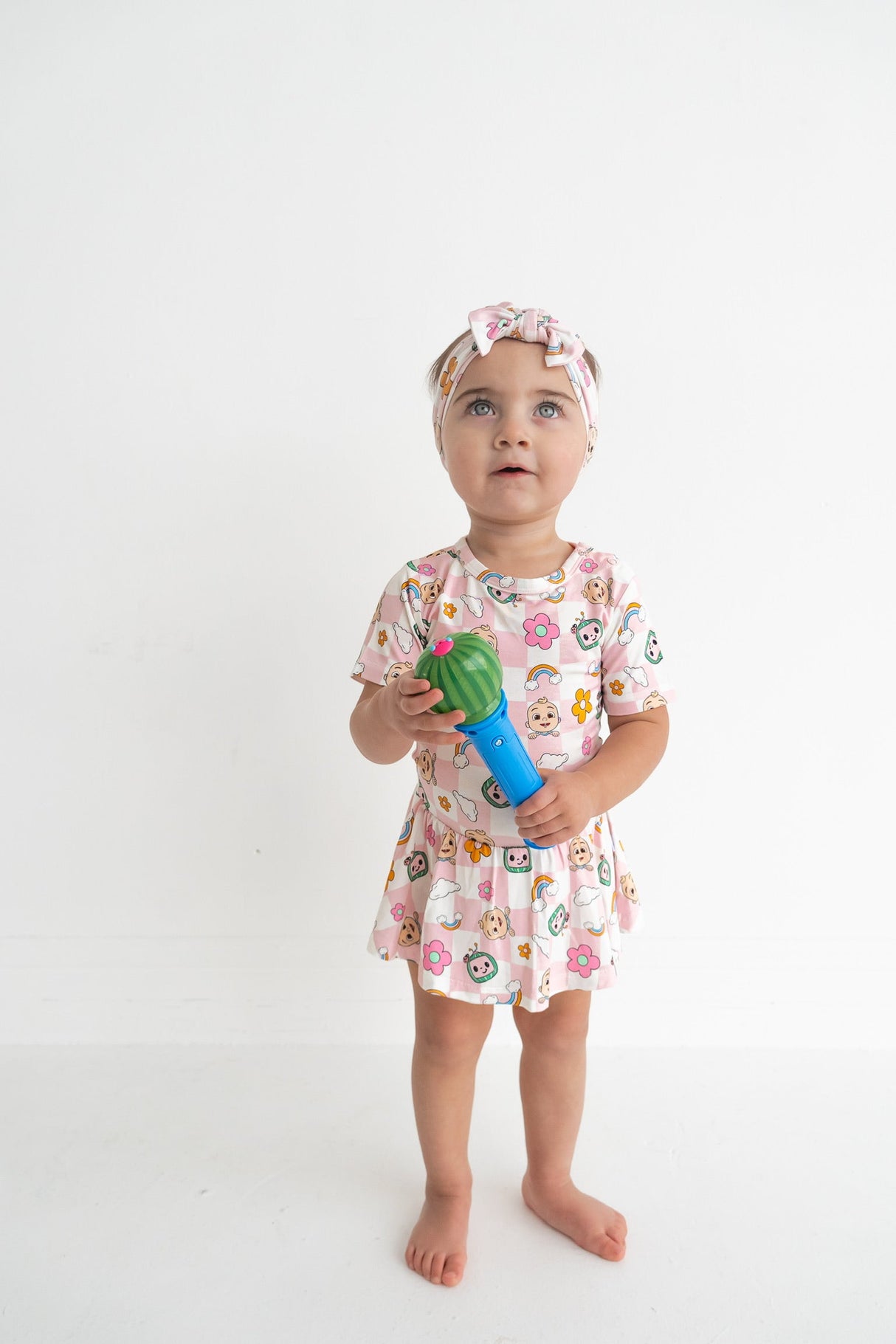 Dream Big Little Co x CoComelon JJ RAINBOW CHECKERS SHORT SLEEVE DREAM BODYSUIT DRESS from DREAM BIG LITTLE CO