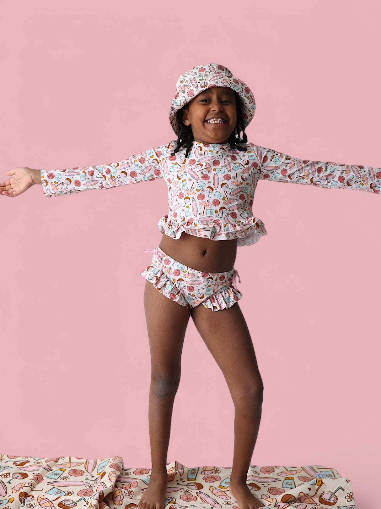 FUN IN THE SUN DREAM TWO-PIECE RASH GUARD RUFFLE SWIM SUIT from DREAM BIG LITTLE CO