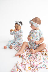 Dream Big Little Co x CoComelon SPRINGTIME MELON DREAM RUFFLE ROMPER from DREAM BIG LITTLE CO