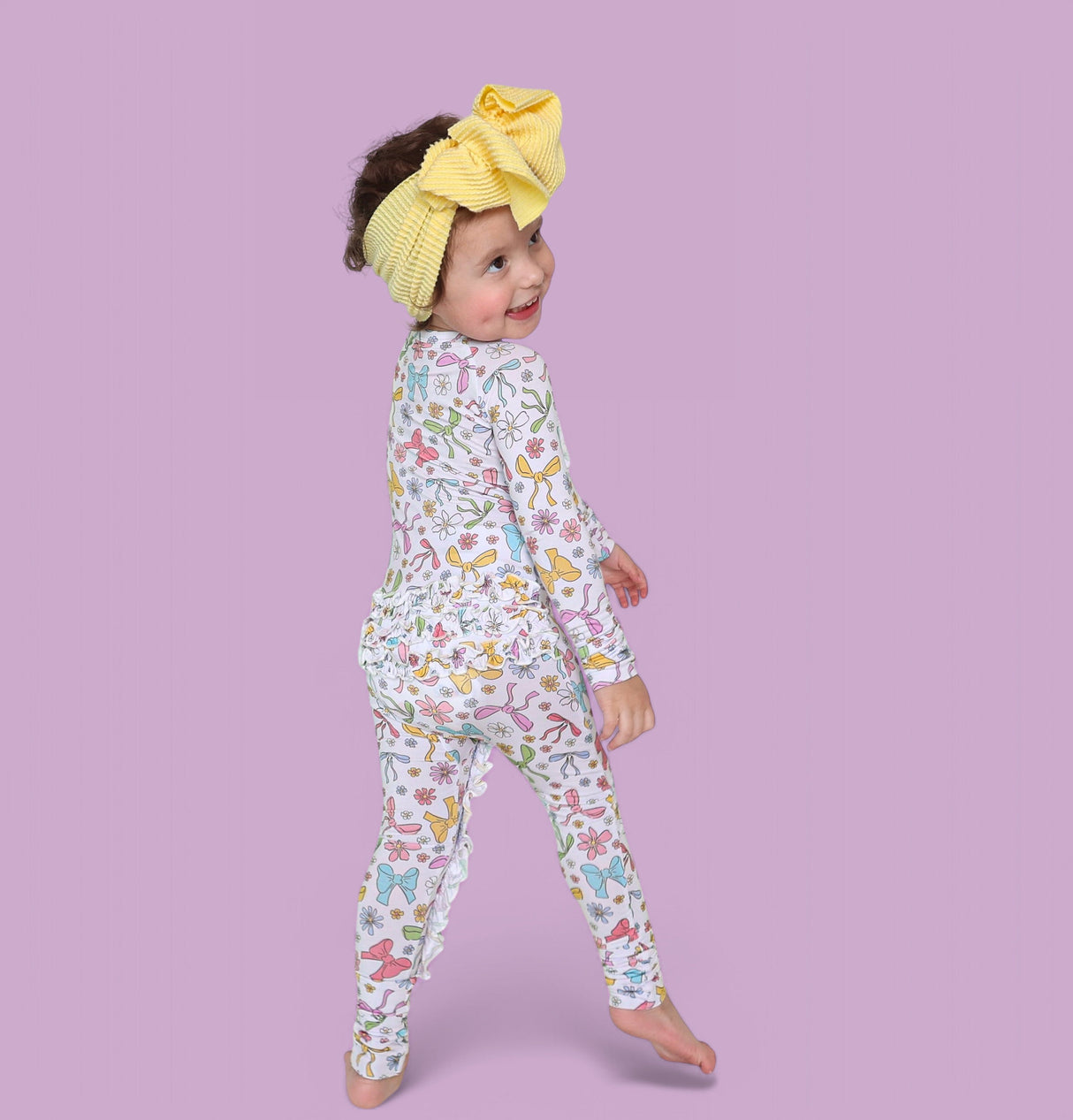 BOW GARDEN DREAM RUFFLE ROMPER from DREAM BIG LITTLE CO