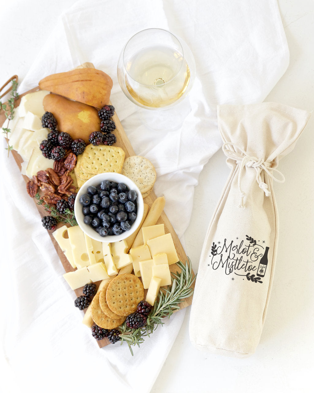 Merlot and Mistletoe Christmas Cotton Canvas Wine Bag from The Cotton & Canvas Co.