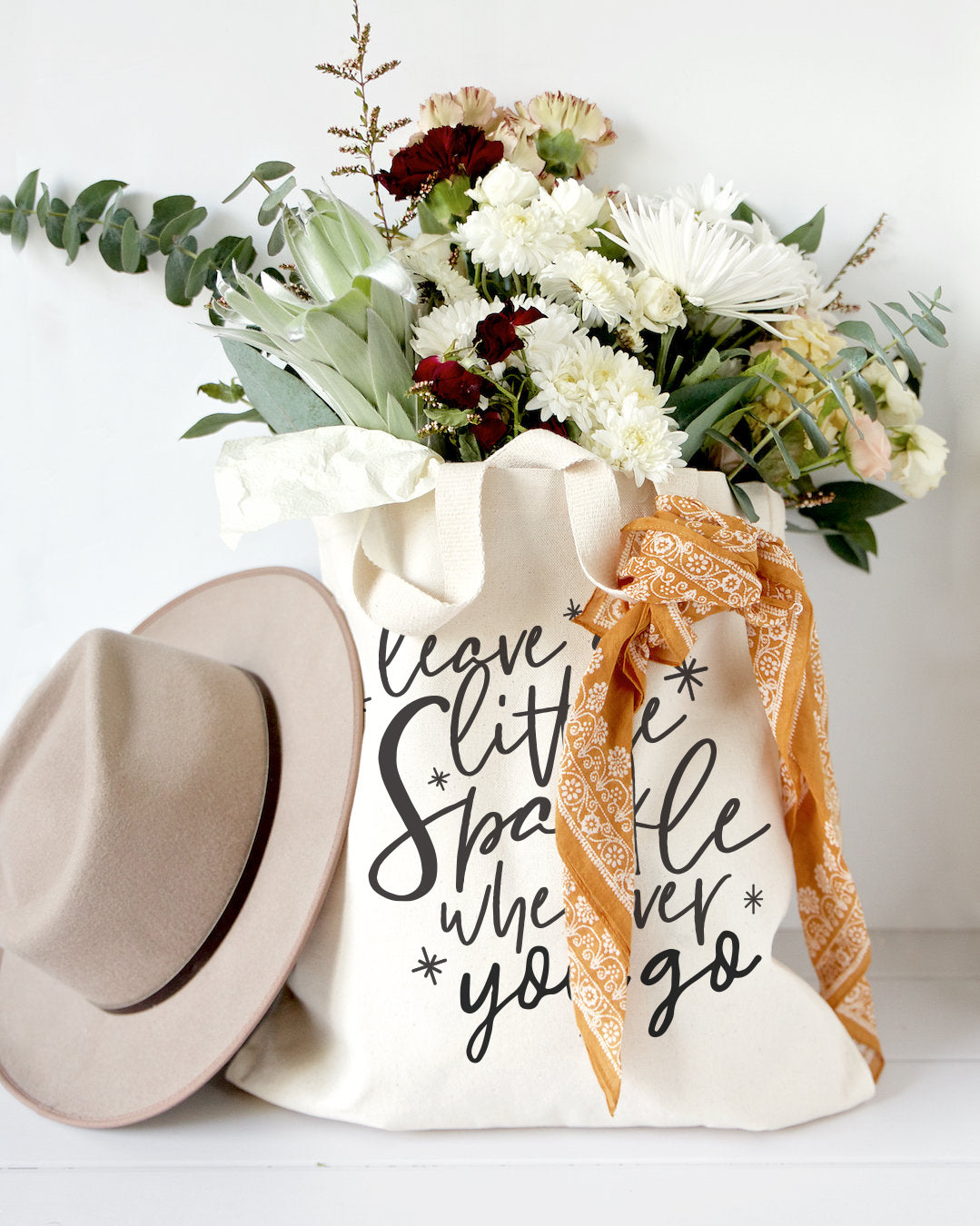 Leave a Little Sparkle Wherever You Go Cotton Canvas Tote Bag from The Cotton & Canvas Co.