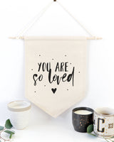 You Are So Loved Hanging Wall Banner from The Cotton & Canvas Co.