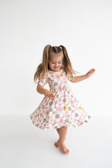 Dream Big Little Co x CoComelon JJ RAINBOW CHECKERS SHORT SLEEVE DREAM RUFFLE DRESS from DREAM BIG LITTLE CO