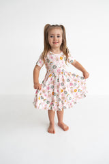 Dream Big Little Co x CoComelon JJ RAINBOW CHECKERS SHORT SLEEVE DREAM RUFFLE DRESS from DREAM BIG LITTLE CO