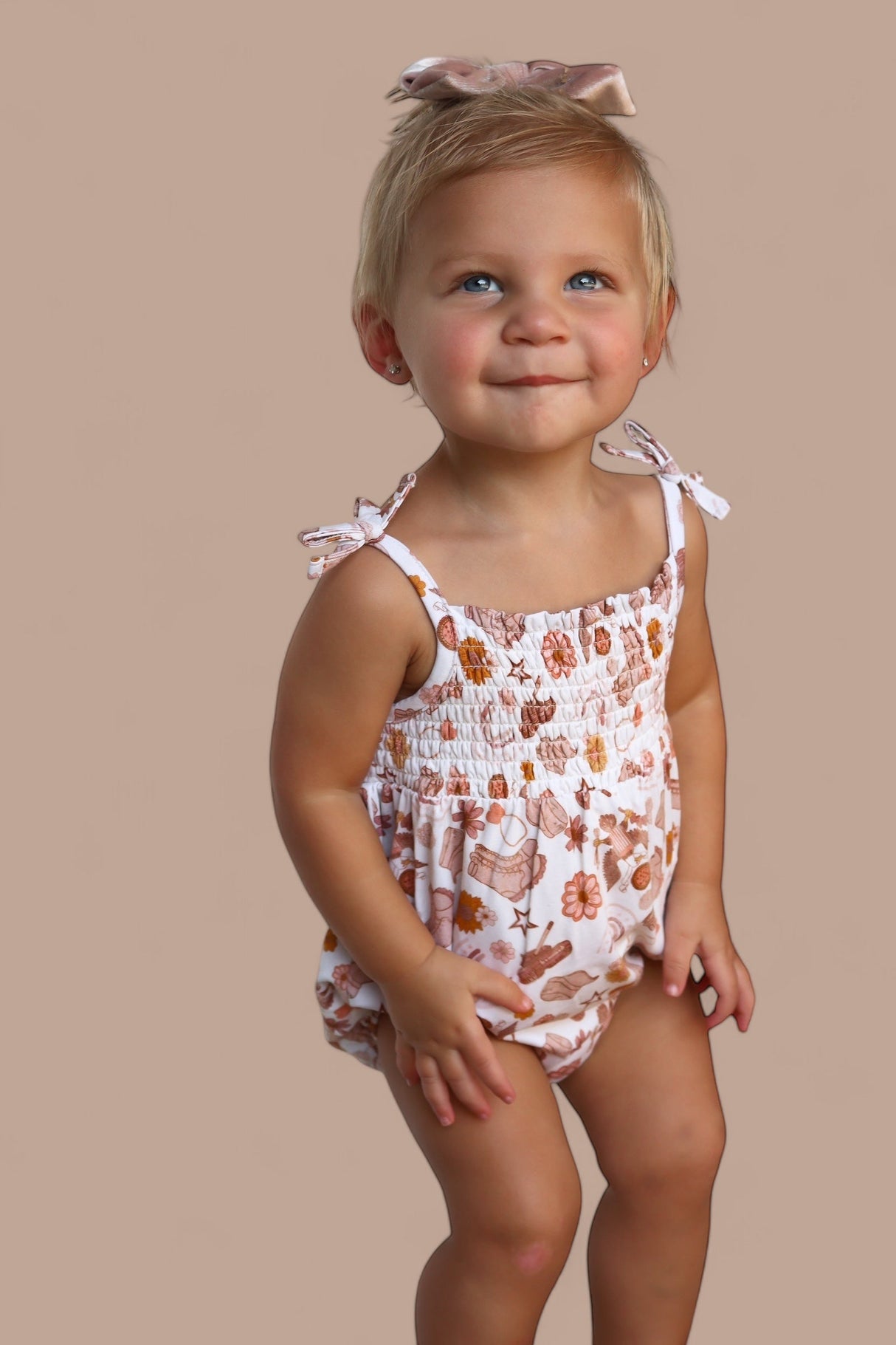 FLOWERS AND BOOTS DREAM BUBBLE ROMPER from DREAM BIG LITTLE CO