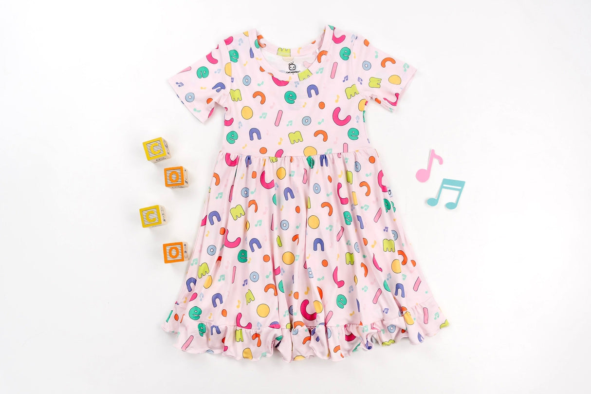 Dream Big Little Co x CoComelon ALPHABET SHORT SLEEVE DREAM RUFFLE DRESS from DREAM BIG LITTLE CO