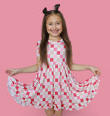 DREAMY PINK CHECKERS DREAM RUFFLE DRESS from DREAM BIG LITTLE CO