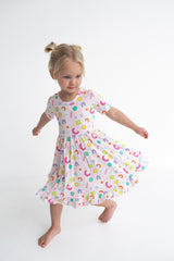 Dream Big Little Co x CoComelon ALPHABET SHORT SLEEVE DREAM RUFFLE DRESS from DREAM BIG LITTLE CO