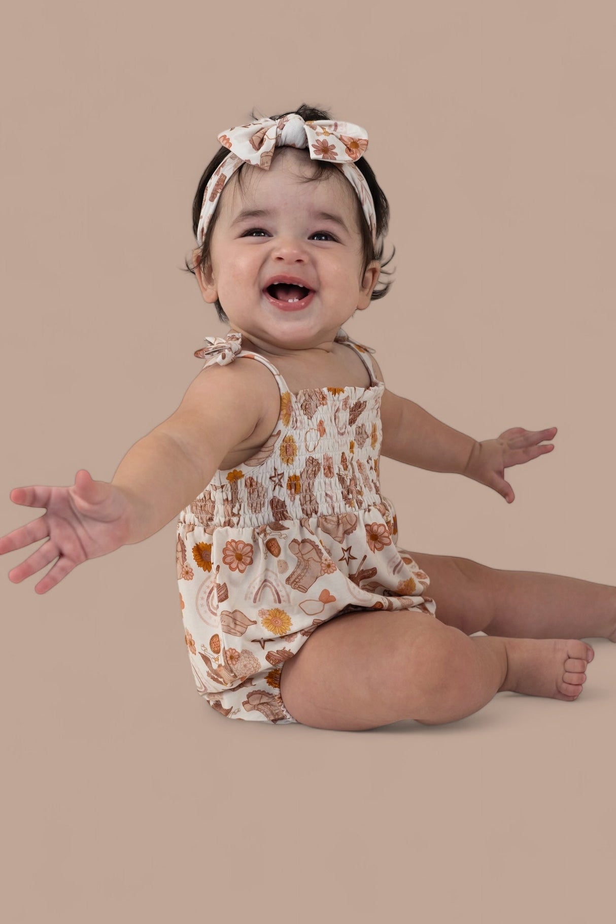 FLOWERS AND BOOTS DREAM BUBBLE ROMPER from DREAM BIG LITTLE CO