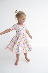 Dream Big Little Co x CoComelon ALPHABET SHORT SLEEVE DREAM RUFFLE DRESS from DREAM BIG LITTLE CO