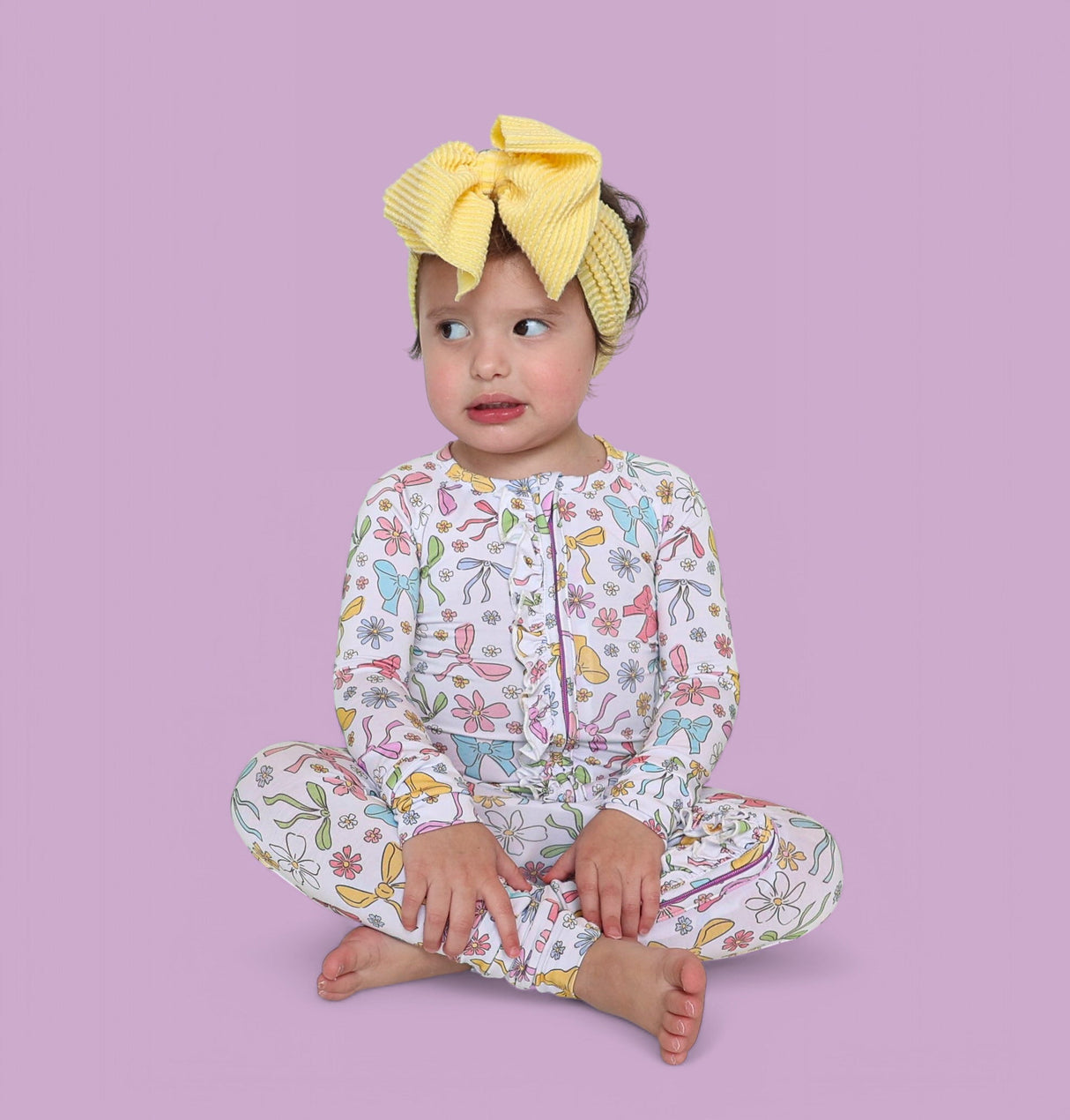 BOW GARDEN DREAM RUFFLE ROMPER from DREAM BIG LITTLE CO