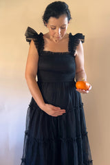 Black Smocked Mesh Ruffle Accent Maternity Midi Dress from PinkBlush