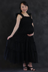 Black Smocked Mesh Ruffle Accent Maternity Midi Dress from PinkBlush