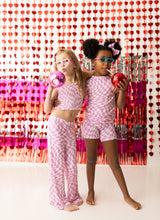 BUBBLEGUM WAVY CHECKERS DREAM SMOCKED FLARE SET from DREAM BIG LITTLE CO