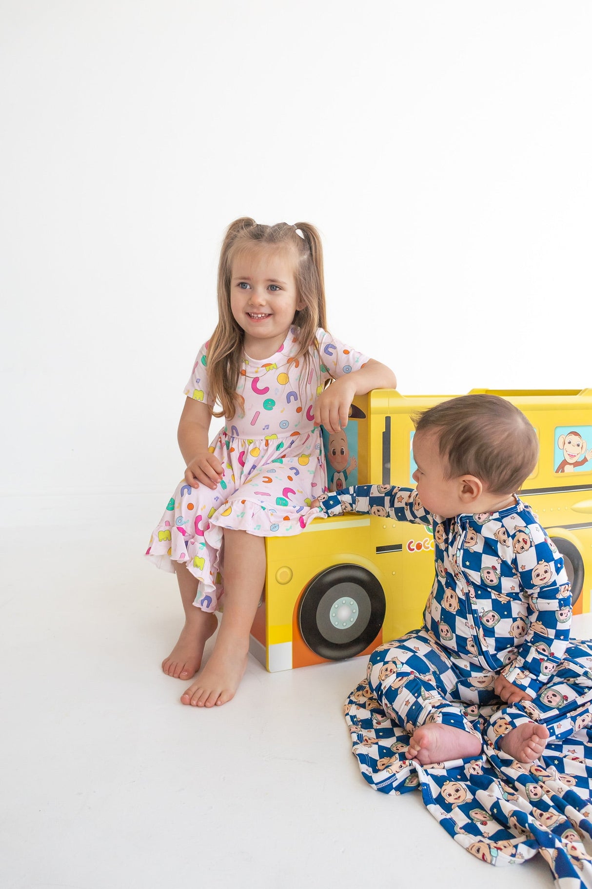 Dream Big Little Co x CoComelon ALPHABET SHORT SLEEVE DREAM RUFFLE DRESS from DREAM BIG LITTLE CO