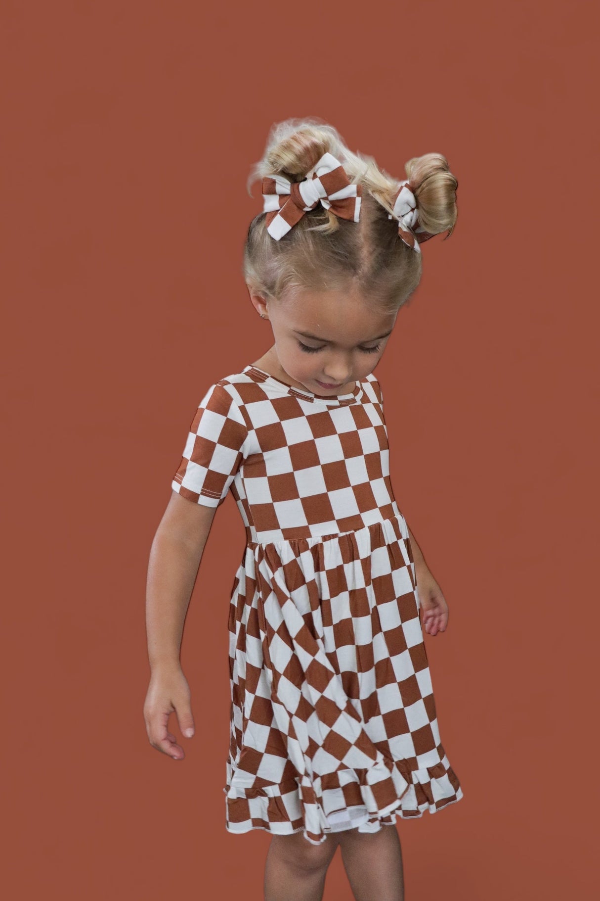 COPPER CHECKERS DREAM RUFFLE DRESS from DREAM BIG LITTLE CO