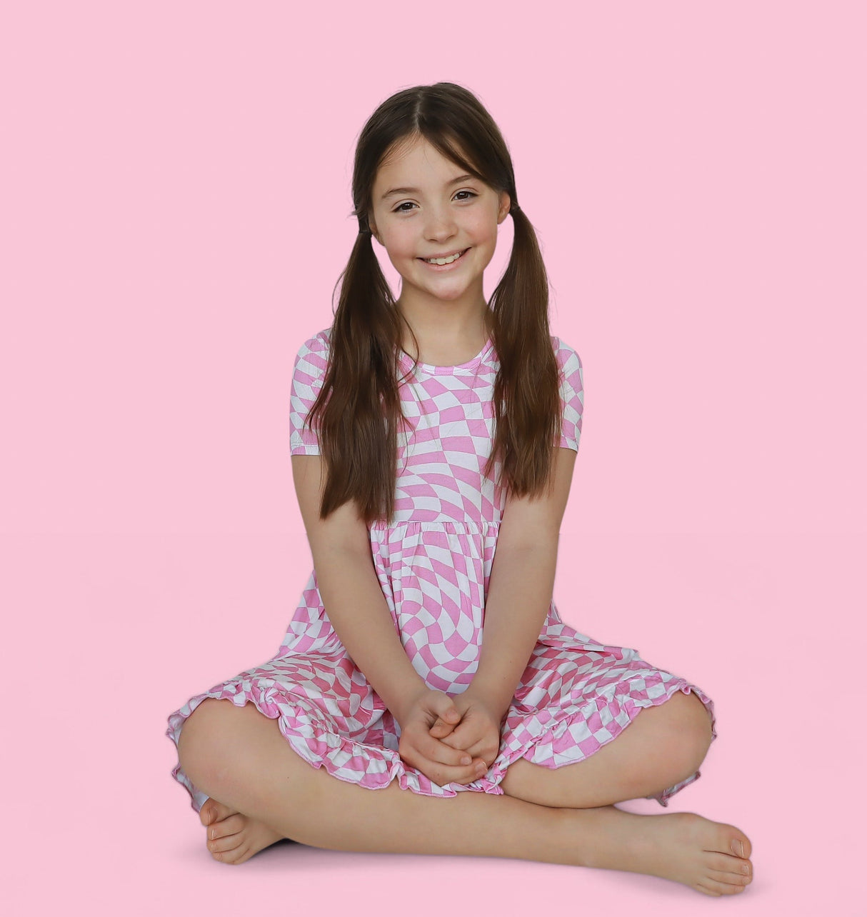 BUBBLEGUM WAVY CHECKERS DREAM RUFFLE DRESS from DREAM BIG LITTLE CO