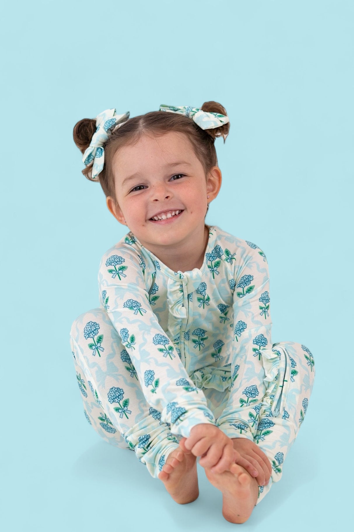 BLUE RIBBON BLOOMS DREAM RUFFLE ROMPER from DREAM BIG LITTLE CO