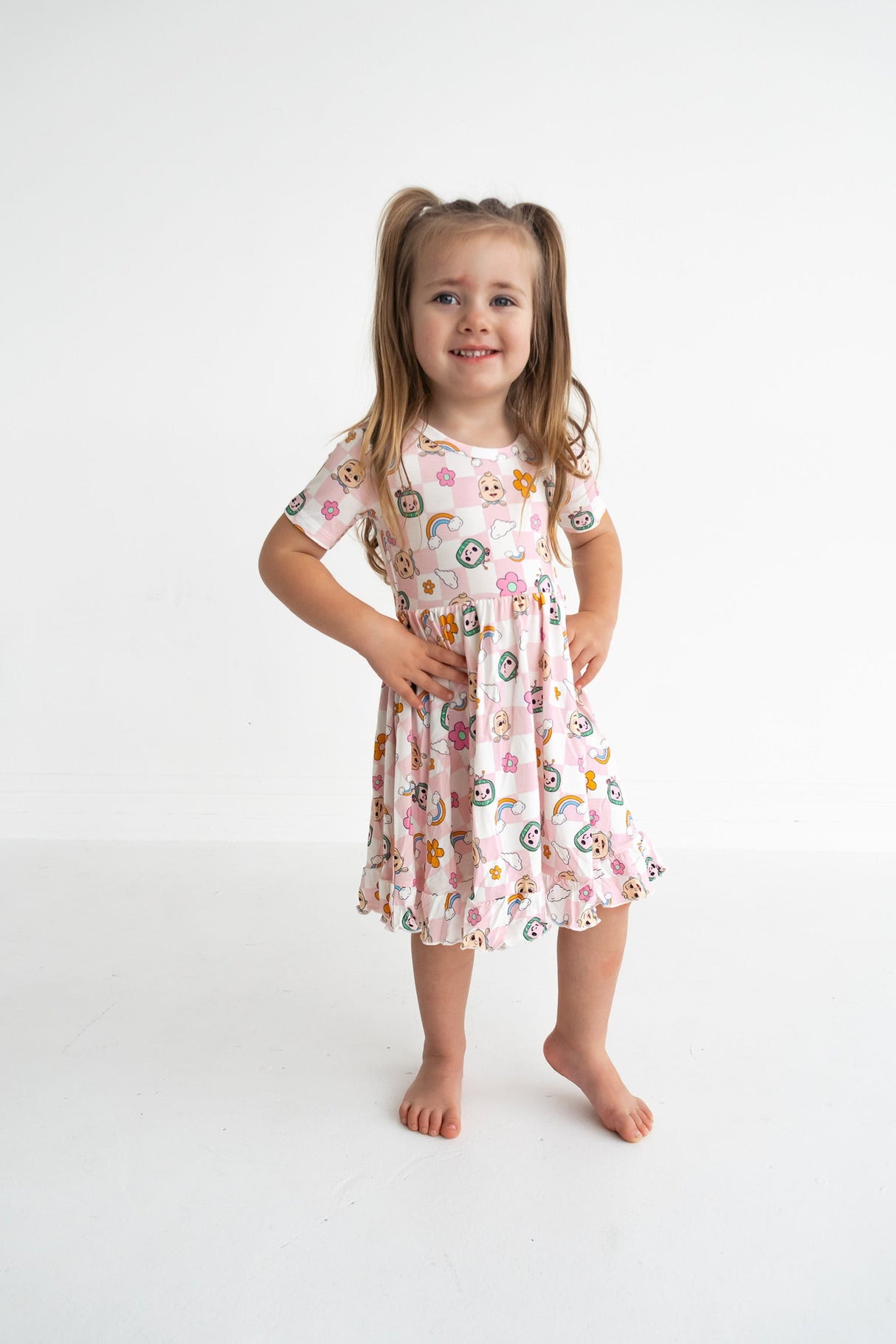 Dream Big Little Co x CoComelon JJ RAINBOW CHECKERS SHORT SLEEVE DREAM RUFFLE DRESS from DREAM BIG LITTLE CO