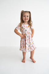Dream Big Little Co x CoComelon JJ RAINBOW CHECKERS SHORT SLEEVE DREAM RUFFLE DRESS from DREAM BIG LITTLE CO