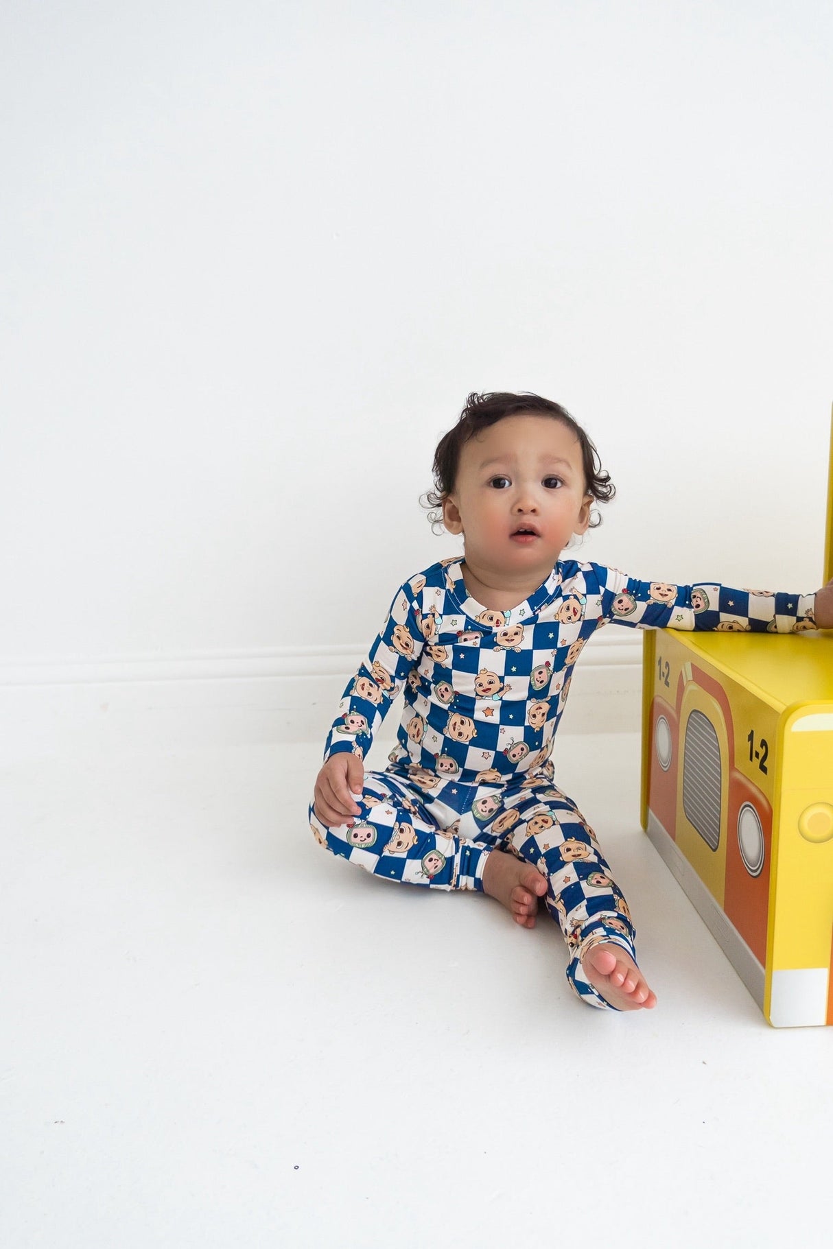 Dream Big Little Co x CoComelon JJ STARRY NIGHT CHECKERS DREAM ROMPER from DREAM BIG LITTLE CO