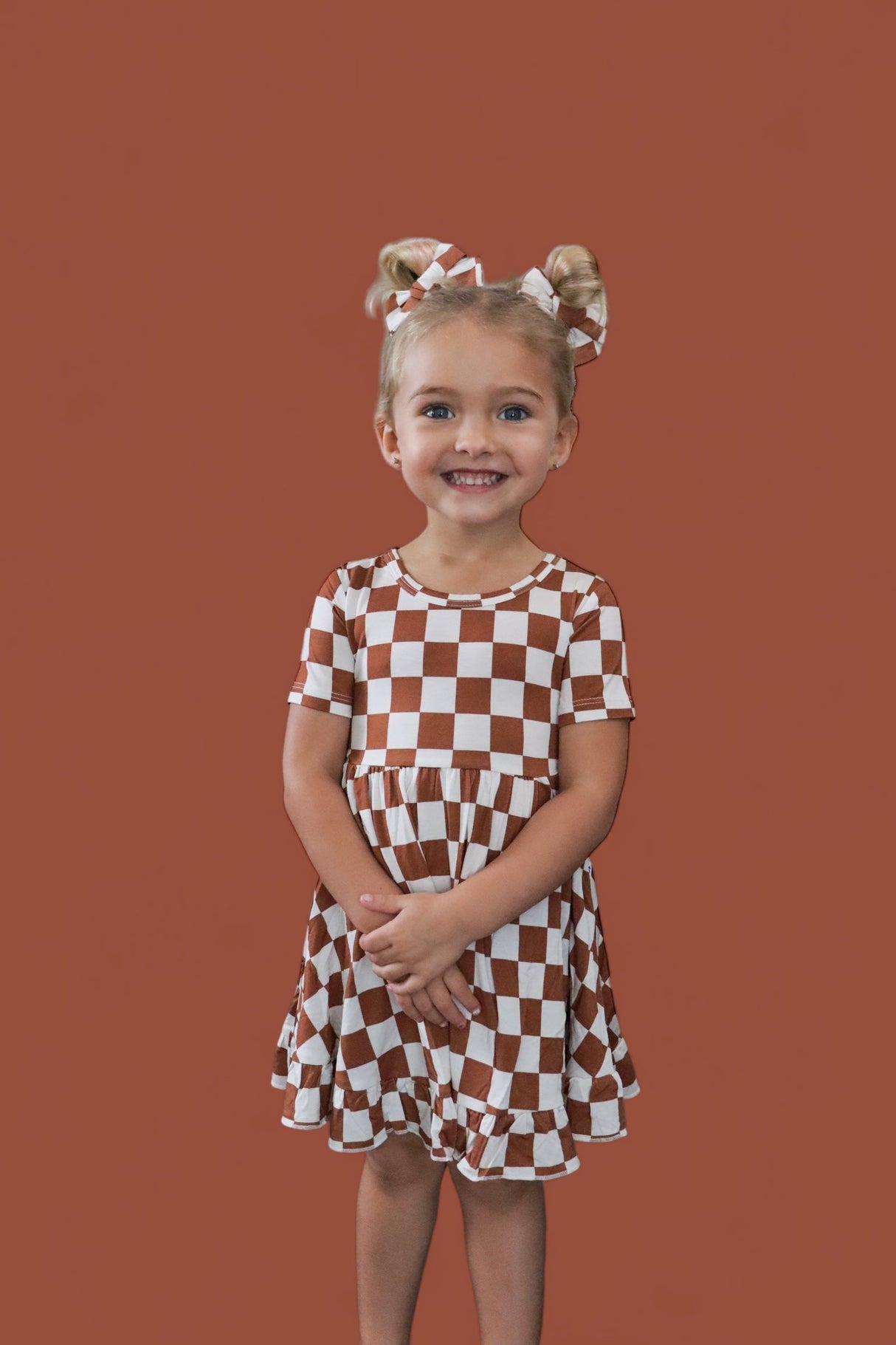 COPPER CHECKERS DREAM RUFFLE DRESS from DREAM BIG LITTLE CO