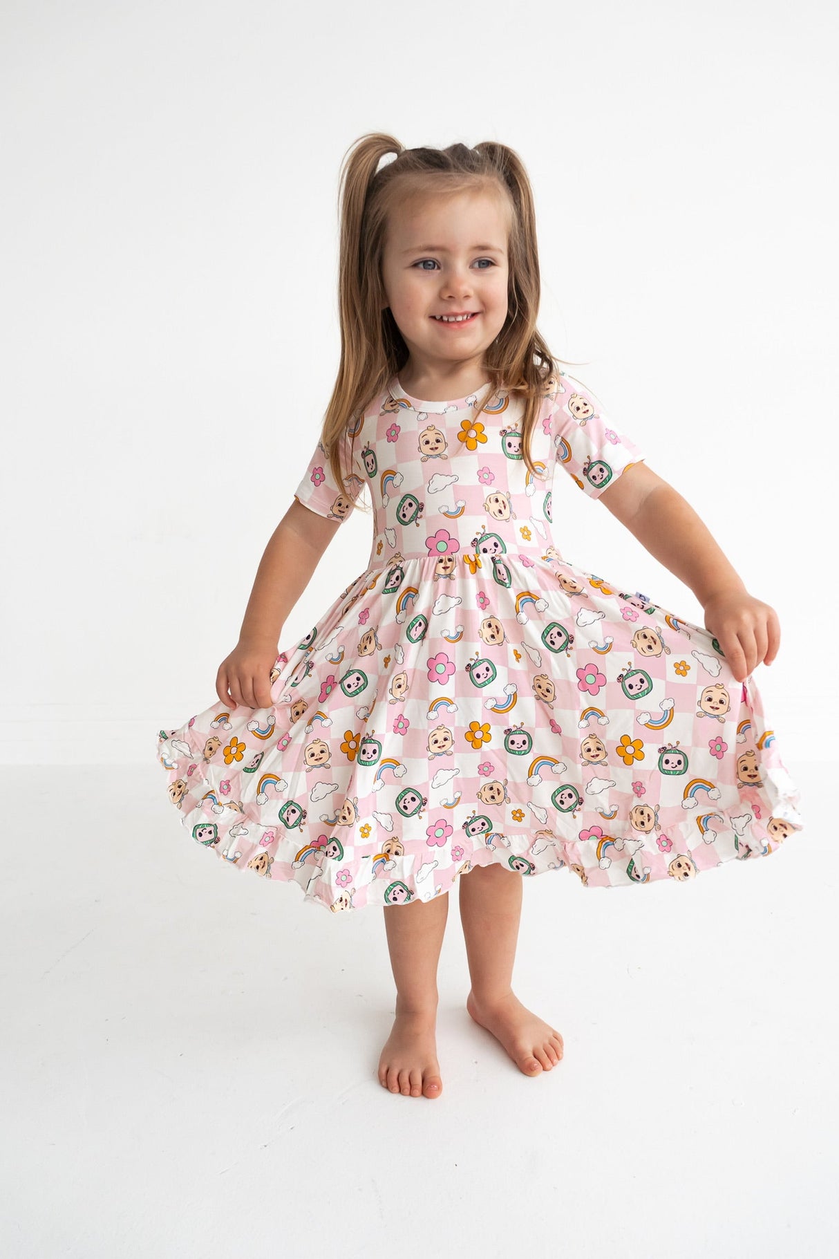 Dream Big Little Co x CoComelon JJ RAINBOW CHECKERS SHORT SLEEVE DREAM RUFFLE DRESS from DREAM BIG LITTLE CO