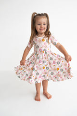 Dream Big Little Co x CoComelon JJ RAINBOW CHECKERS SHORT SLEEVE DREAM RUFFLE DRESS from DREAM BIG LITTLE CO