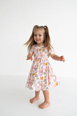 Dream Big Little Co x CoComelon JJ RAINBOW CHECKERS SHORT SLEEVE DREAM RUFFLE DRESS from DREAM BIG LITTLE CO
