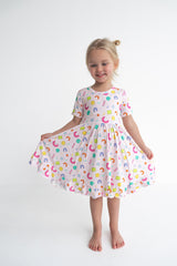 Dream Big Little Co x CoComelon ALPHABET SHORT SLEEVE DREAM RUFFLE DRESS from DREAM BIG LITTLE CO