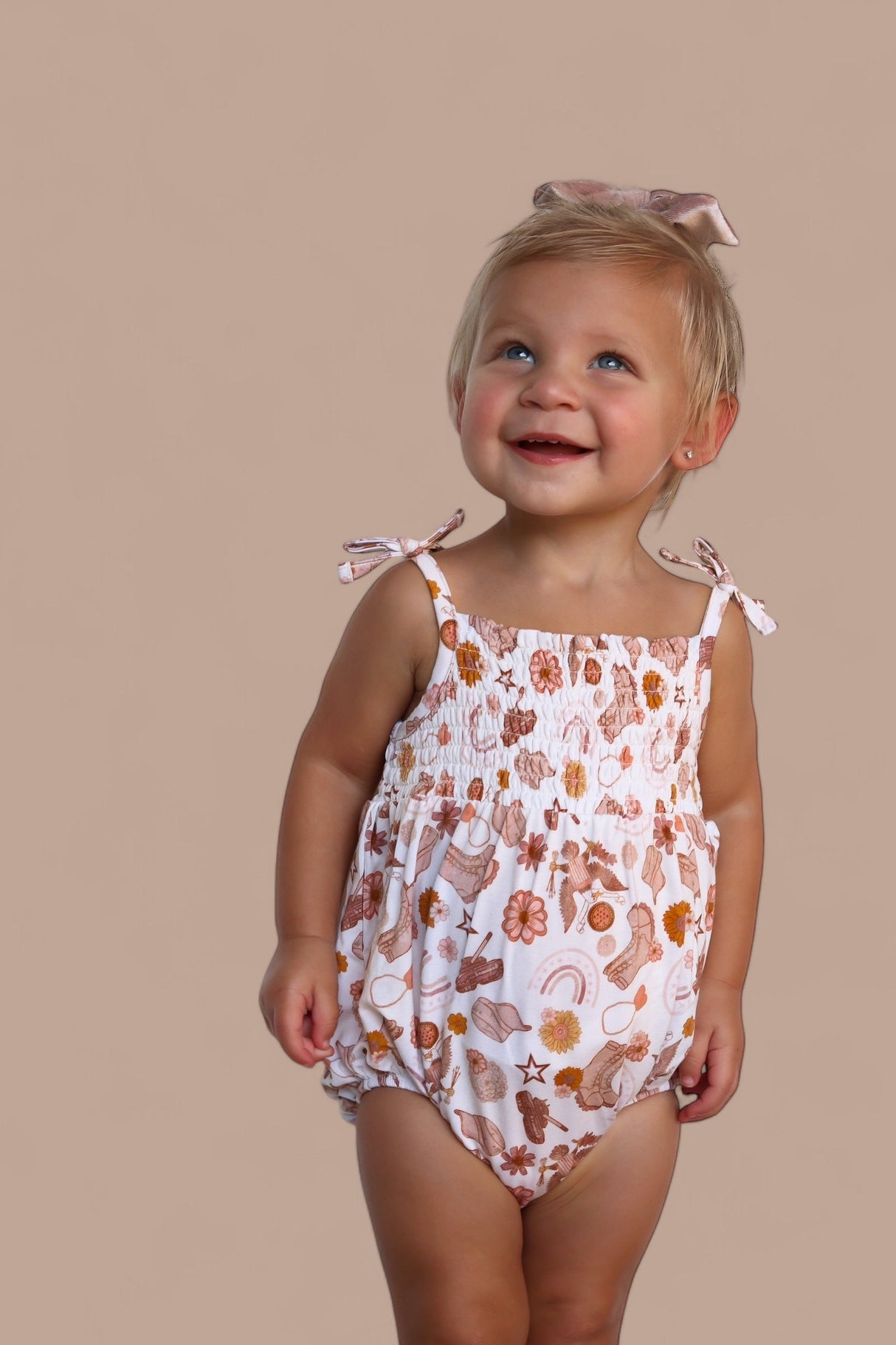 FLOWERS AND BOOTS DREAM BUBBLE ROMPER from DREAM BIG LITTLE CO